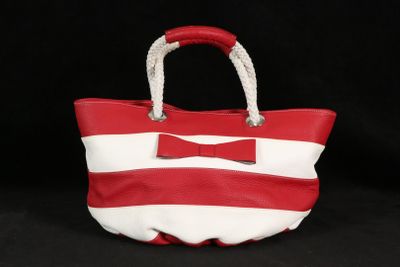 red and white striped handbag with bow accent