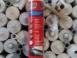 a picture of a tube of glue sitting on a pile of plastic cups