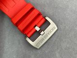 the red watch strap is attached to the silver buckle of the watch