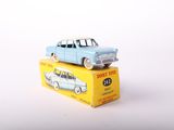 a blue toy car on top of a yellow box