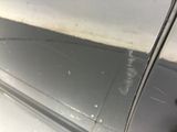 a close up of a car door handle with a sticker on it