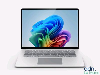 an image of a laptop computer with a colorful design on the screen