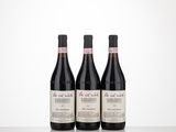 three bottles of wine sitting on top of a table next to each other