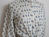 an image of a woman ' s blouse on a mannequin dummy