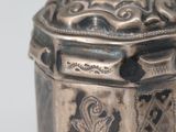 a silver box that is sitting on a table