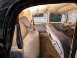 a view of the inside of an old car from the driver ' s seat