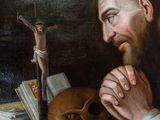 an image of a painting of a man with a skull in front of him