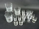 a lot of glasses that are sitting on a table