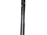 a pair of skis sitting next to each other on a white surface