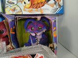 a toy that is sitting on a table next to other toys