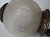 a glass vase with a decorative design on it