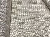 a close up of a bed with a pillow and a pillow case