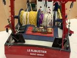 a small model of a boat with a rope on it