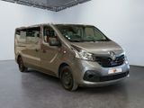 the silver van is parked in a large room with white walls