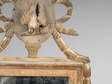 an image of a mirror with a bird on top of it