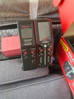 three cell phones that are sitting next to each other