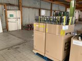many boxes stacked on top of each other in a warehouse