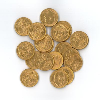 a pile of gold coins on a white surface