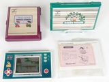three nintendo game consoles sitting next to each other on a white surface