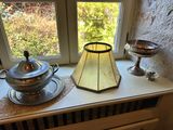 a lamp that is sitting on a window sill