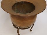 an image of a metal bowl on a stand on a white surface