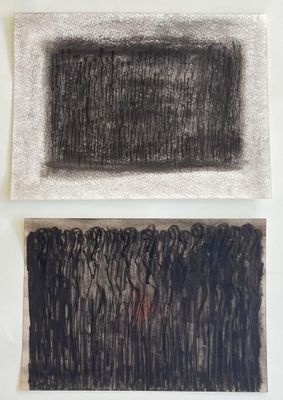 two black and white drawings on a white surface