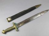 two different types of knives on a white surface