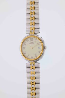 HERMÈS Profil Vers : 1990. Boîtier : rond en acier et doré, …