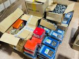 many boxes and boxes of assorted items on the floor