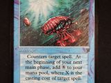 a close up of a card with a picture of a bug on it