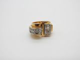 a gold and diamond ring with two rows of diamonds