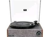 un gros plan d'une platine sur laquelle est posé un tourne-disque