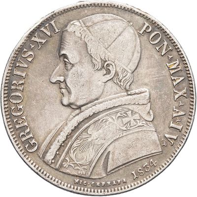 a close up of a silver coin with a man ' s head on it
