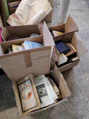 a box full of books sitting on the ground