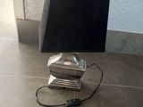 a lamp that is sitting on the floor next to a wall