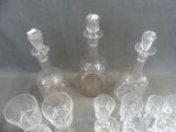 a lot of empty wine glasses and a bottle on the table