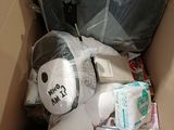 a cardboard box with a stuffed animal inside of it