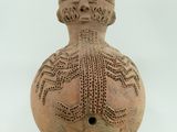 une image représentant un vase sur lequel figure un visage