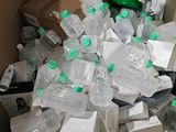 a large box full of bottles of water and other items
