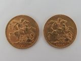 two gold coins with a picture of a man riding a horse