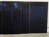 three panels of solar on the floor in a room