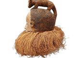 an image of a wooden hat with a cat on top of it