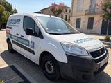 a white van that is parked on the side of the street