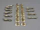 several pieces of silverware are arranged in a row on a gray surface