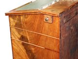 a wooden dresser with a glass top on a white background