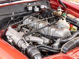 a close up of a car ' s engine with its hood open
