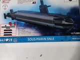 a box with a model of a submarine sitting on a table