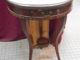 a small table with a clock on it in a store