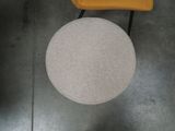 a yellow chair and a white table in a room