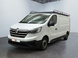 the white van is parked in a large room with a black floor